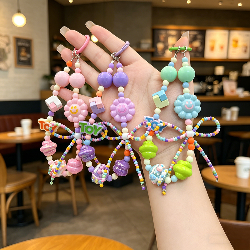 Douyin cross-border hot-selling bow smile cute keychain phone chain, bag pendant, student backpack accessory
